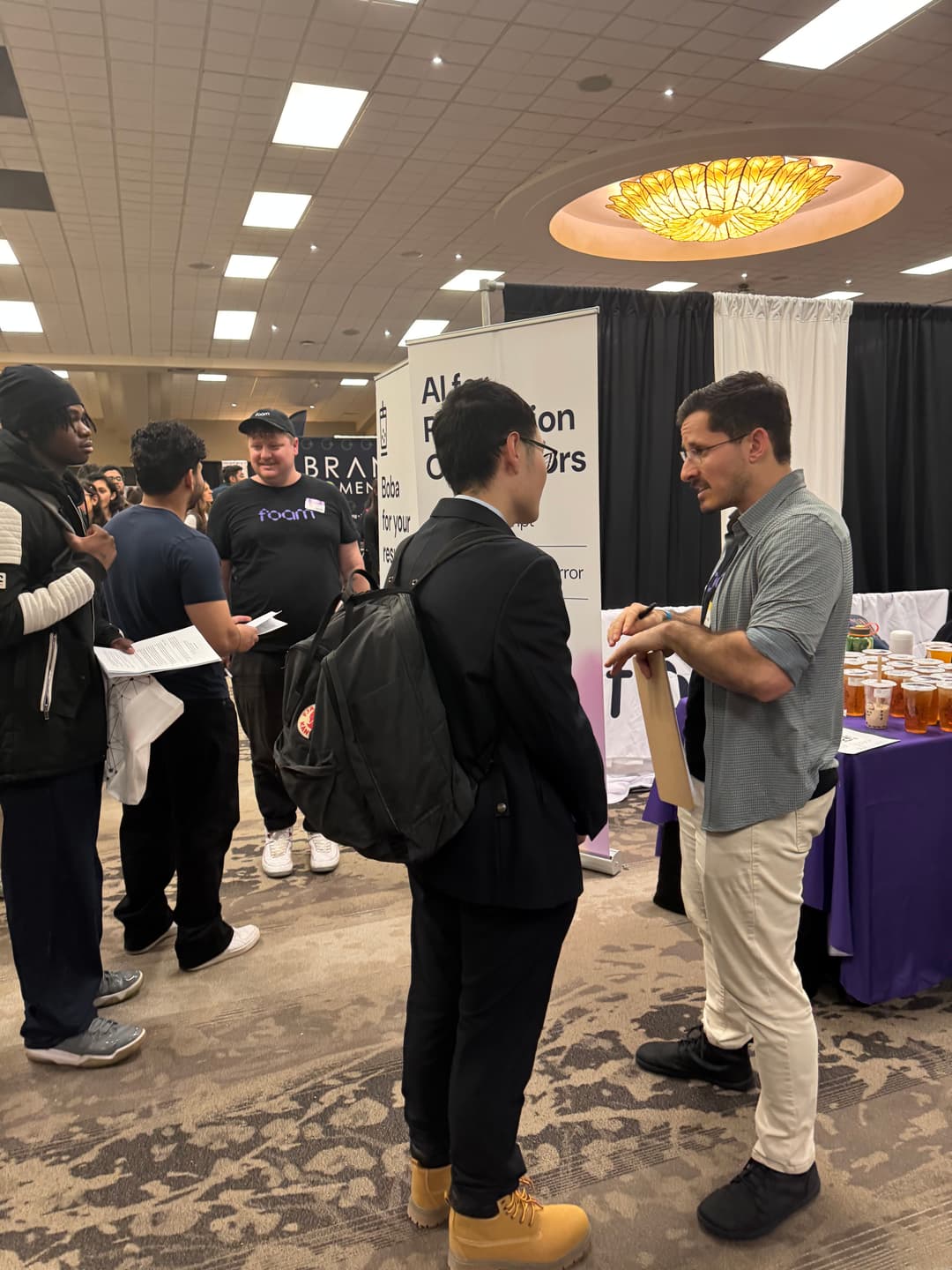 Foam team members talking to candidates at the P4E Job Fair at University of Waterloo